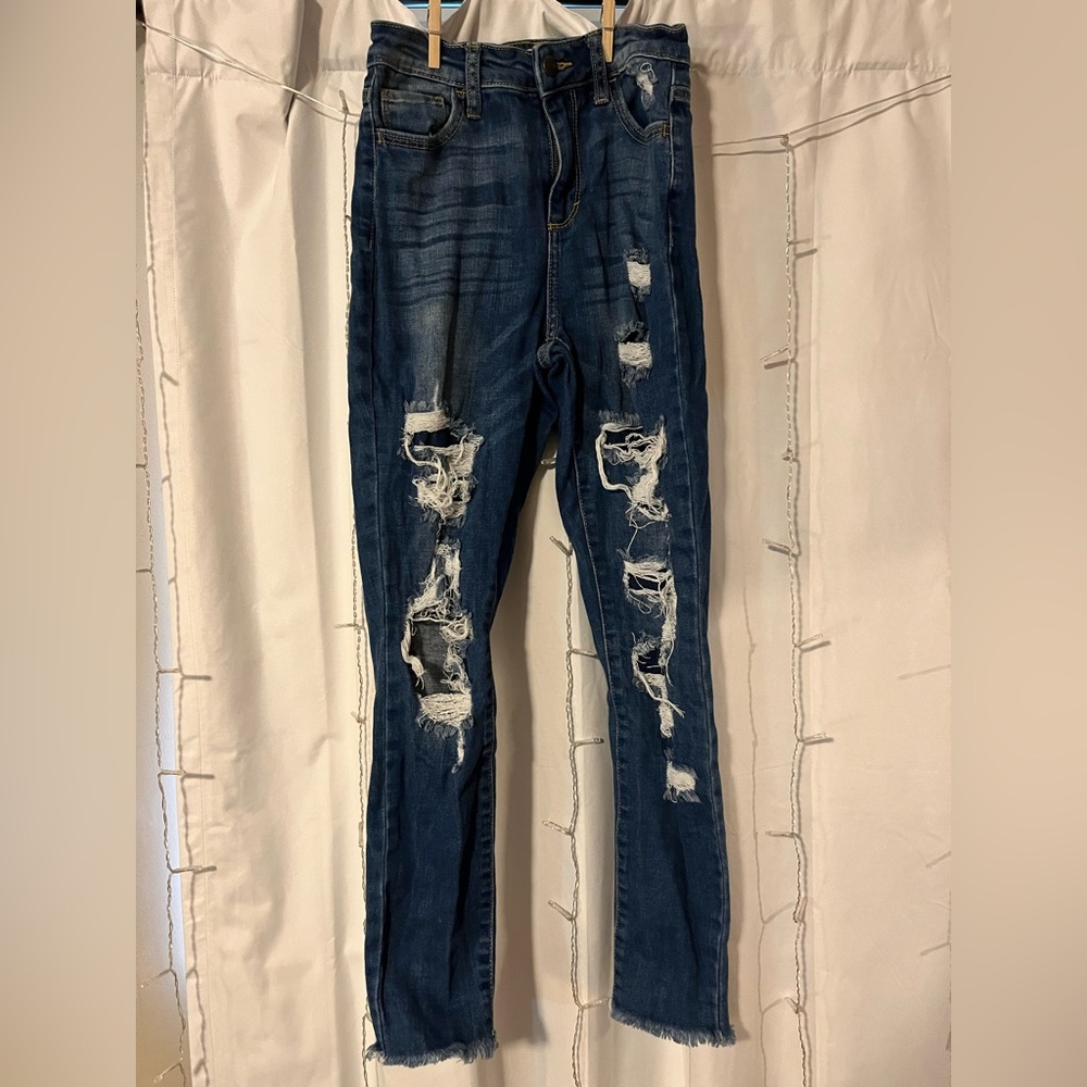 Dark wash skinny jeans with holes